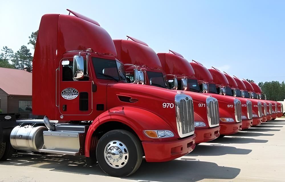 stranco solid waste trucks in a row